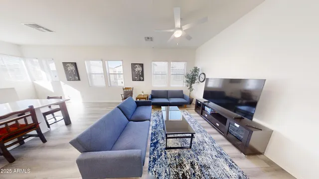 a bedroom with a bed table and a window