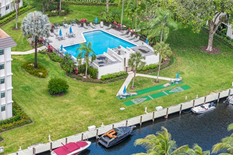 an aerial view of a pool patio fire pit and outdoor seating