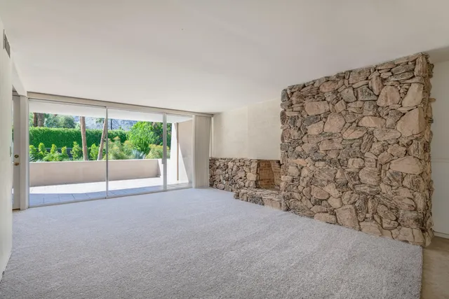a view of kitchen with stainless steel appliances granite countertop a refrigerator a sink and a cabinets