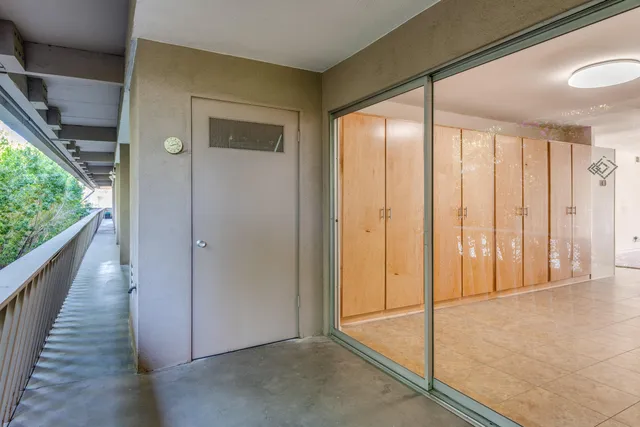 a view of empty room with sliding door