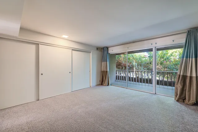 a view of a glass door and the balcony