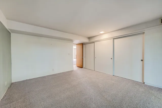 a bathroom with a double vanity sink mirror and toilet