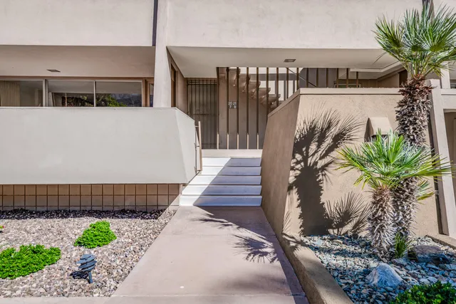 a view of a house with a potted plant