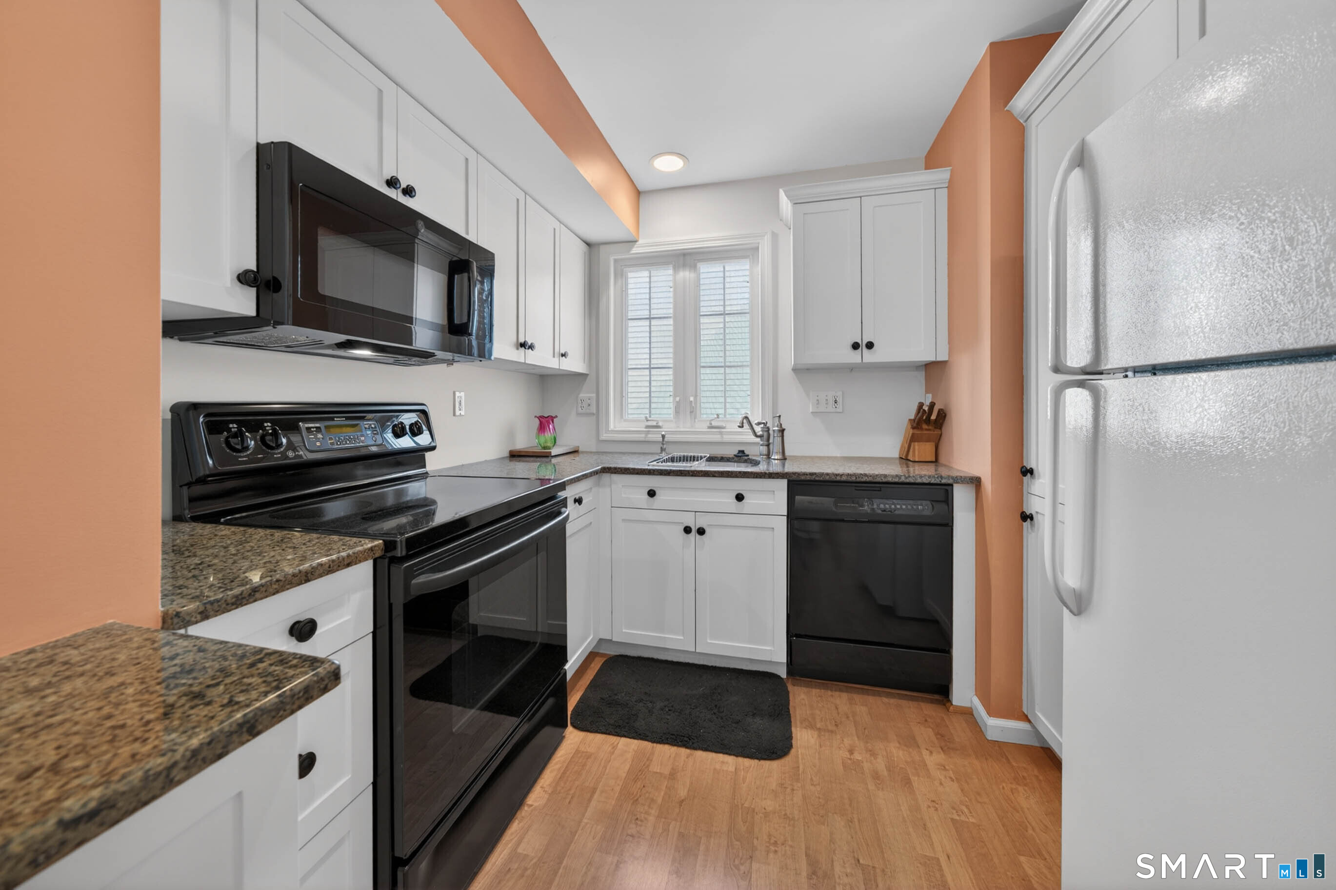 65 Forest Road, Unit D Milford, CT 06461 - Photo 12 of 39 Updated kitchen with granite countertops and ample storage.