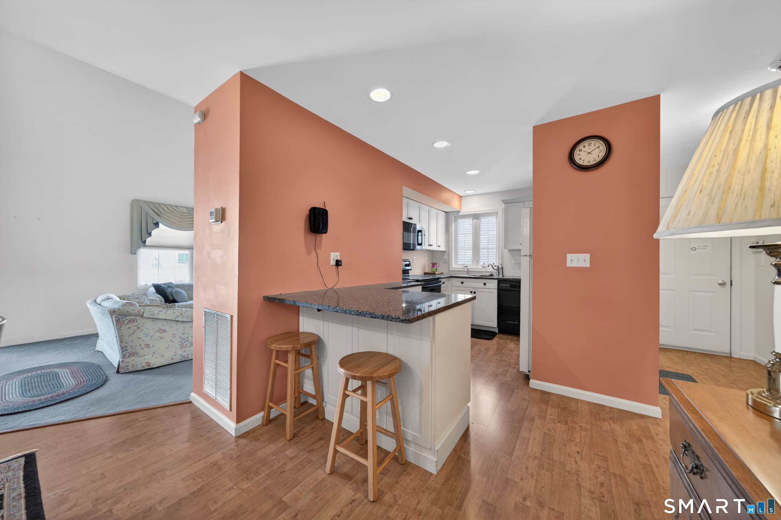 65 Forest Road, Unit D Milford, CT 06461 - Photo 15 of 39 The kitchen with breakfast bar is convenient to the garage entrance down the hallway.