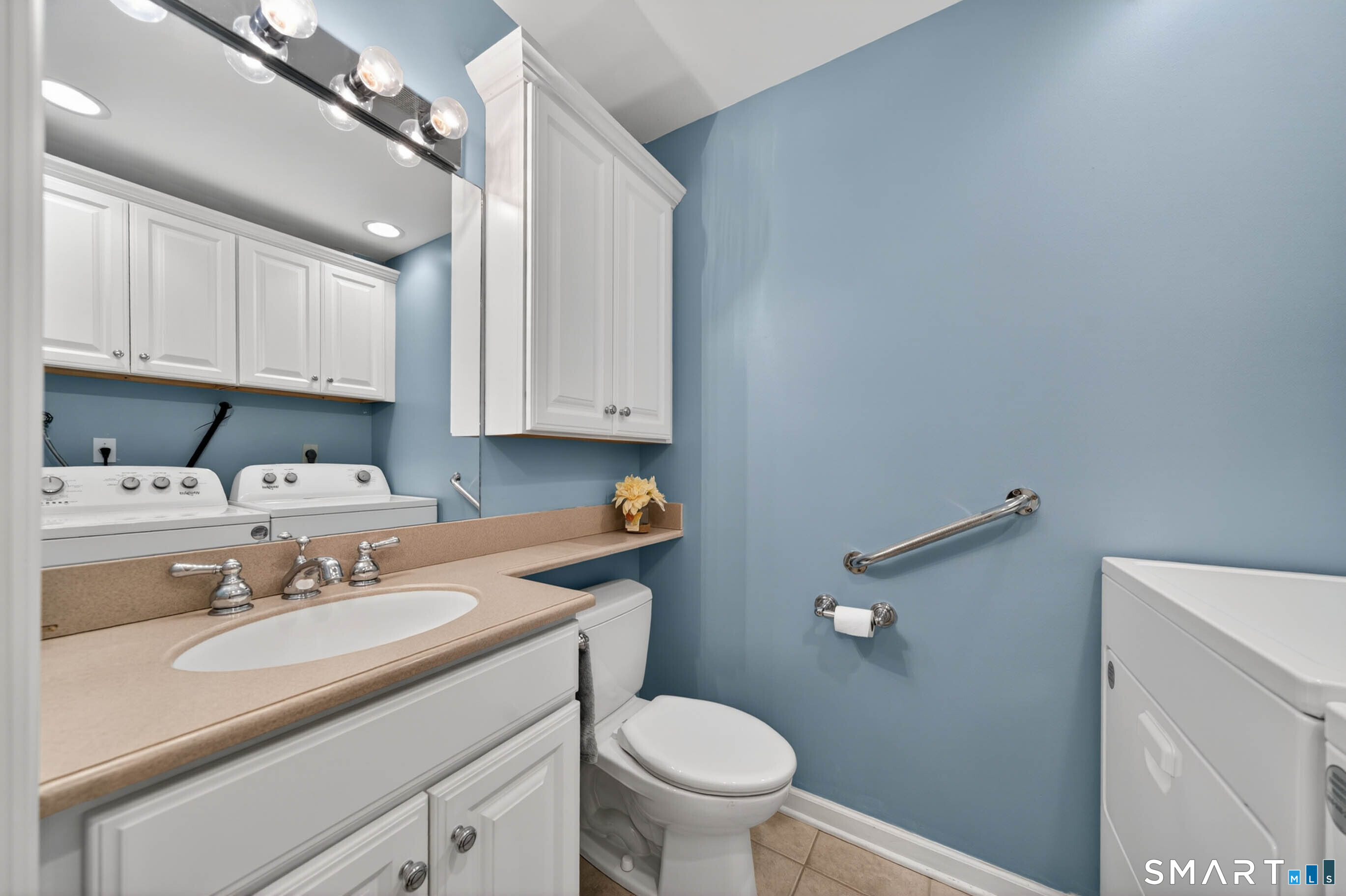 65 Forest Road, Unit D Milford, CT 06461 - Photo 20 of 39 First floor guest bathroom with full size washer & dryer.