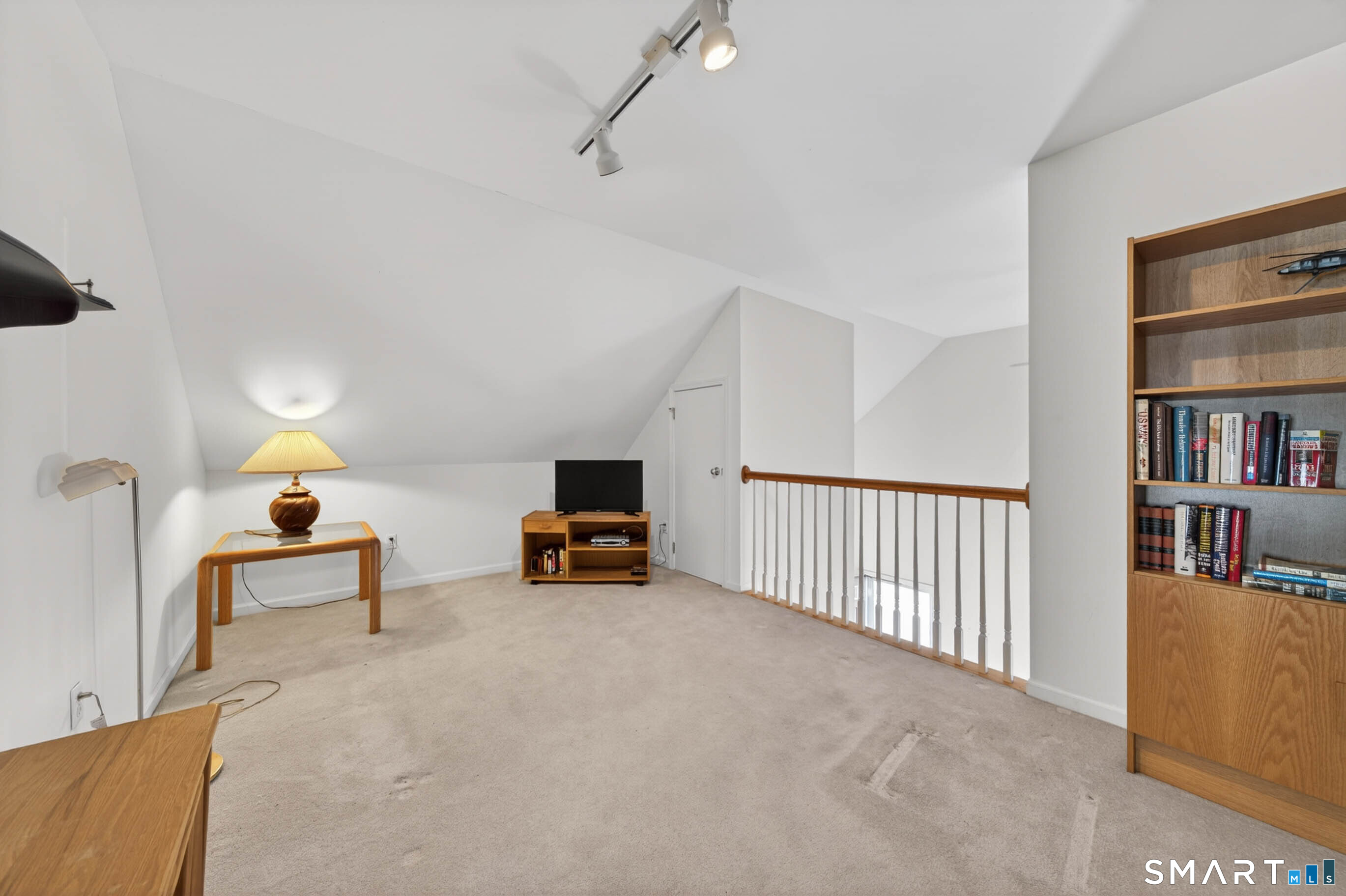65 Forest Road, Unit D Milford, CT 06461 - Photo 22 of 39 Spacious and airy loft area overlooking the living room. Perfect as an office, exercise area or den.