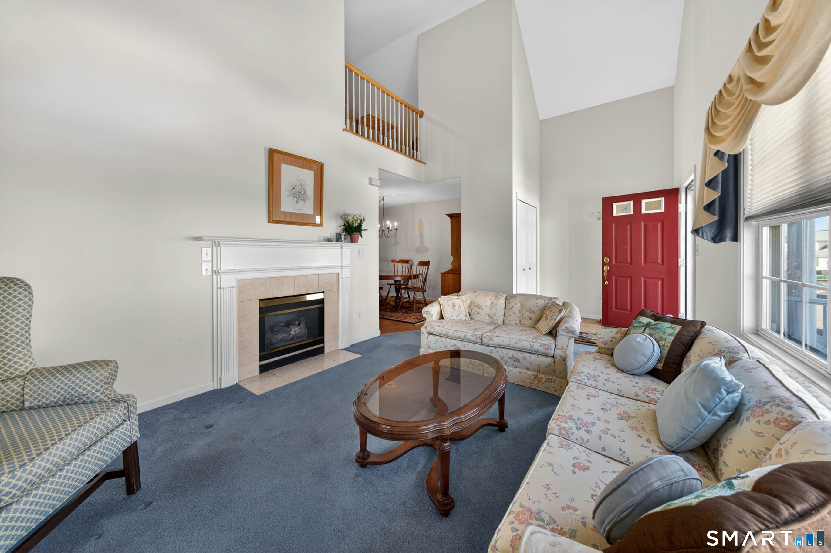 65 Forest Road, Unit D Milford, CT 06461 - Photo 8 of 39 With view of the gas fireplace, vaulted ceiling and 2nd floor loft area.