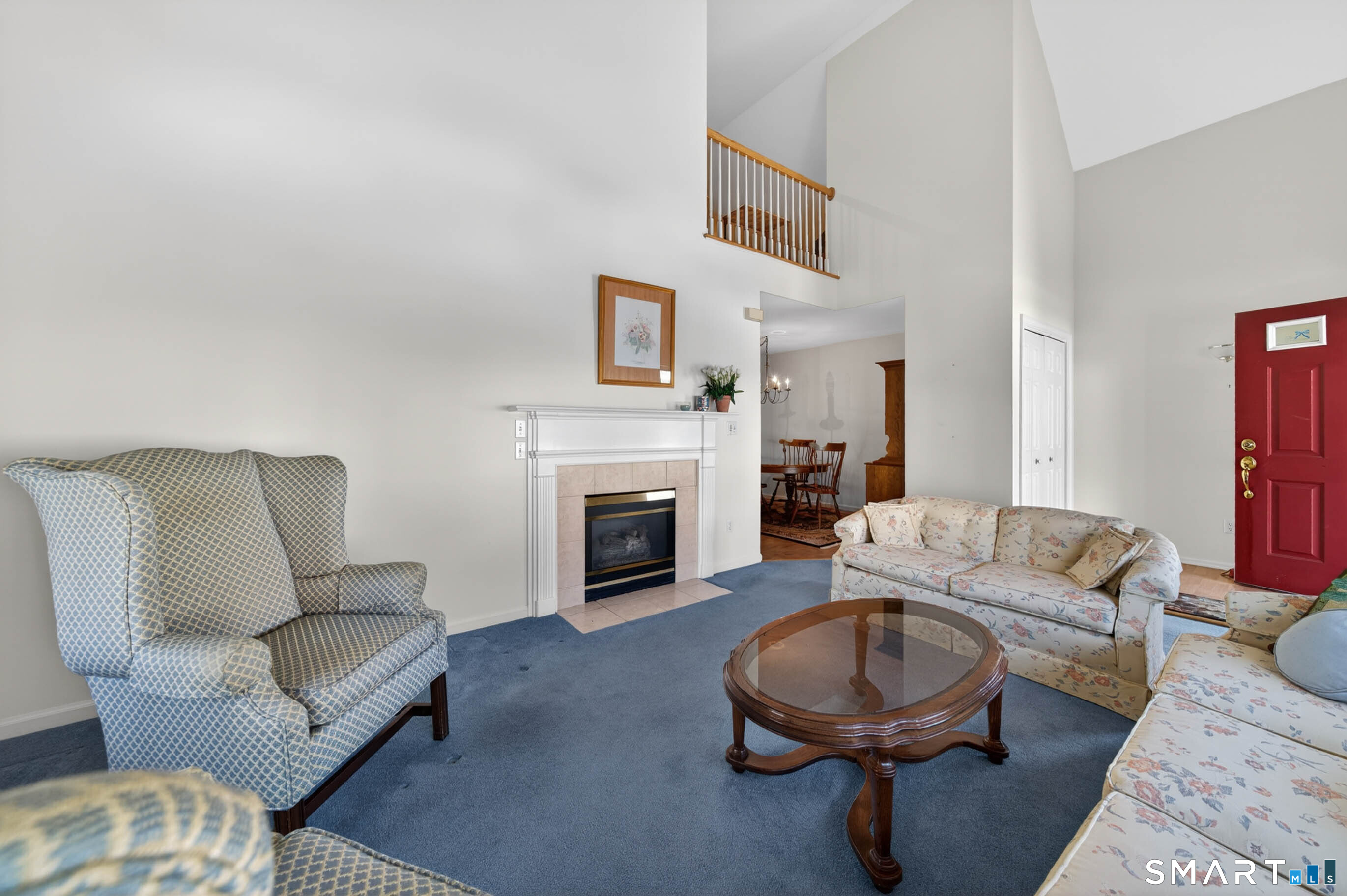 65 Forest Road, Unit D Milford, CT 06461 - Photo 9 of 39 With view of the gas fireplace, vaulted ceiling and 2nd floor loft area.