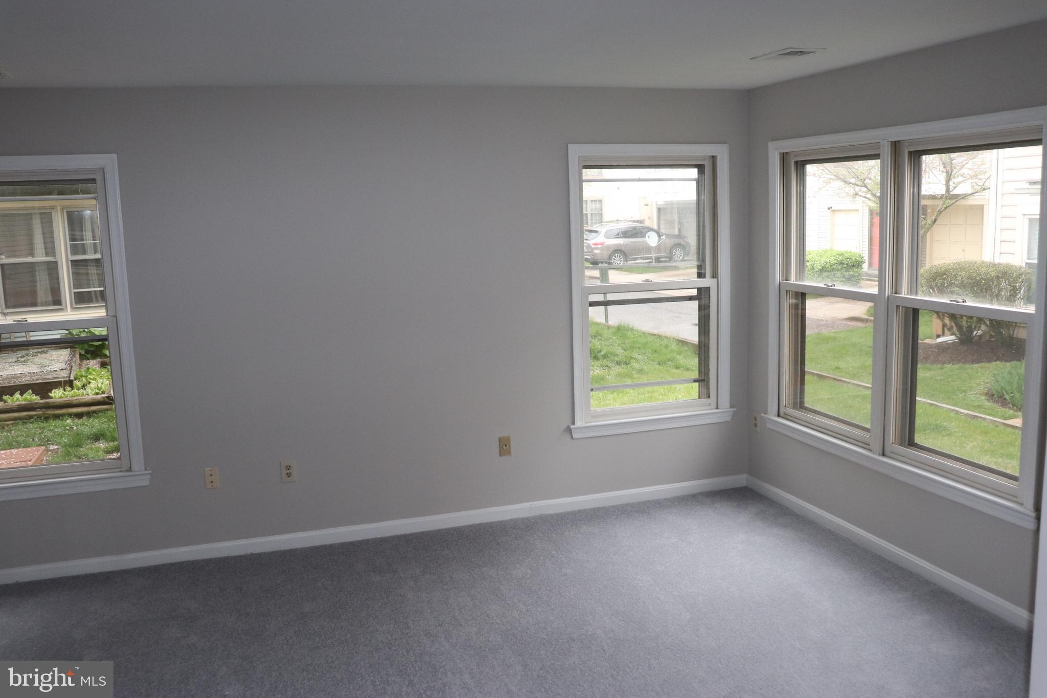 9324 Player Drive, Unit 124 Laurel, MD 20708 - Photo 15 of 34 Sun-Drenched Living Room