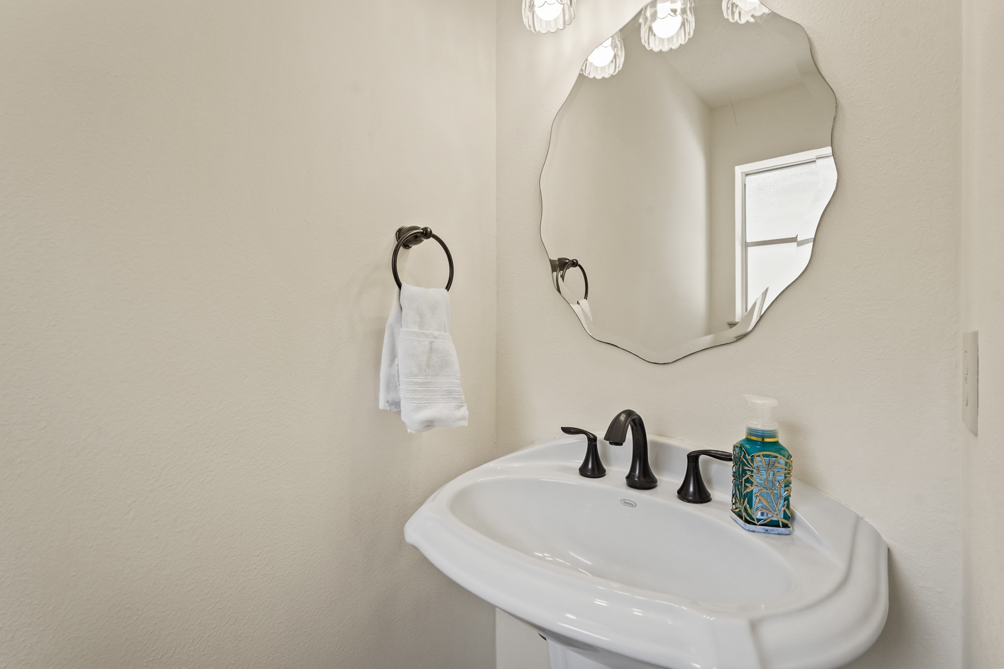 17606 Rustington Drive Spring, TX 77379 - Photo 16 of 44 a bathroom with a sink and mirror