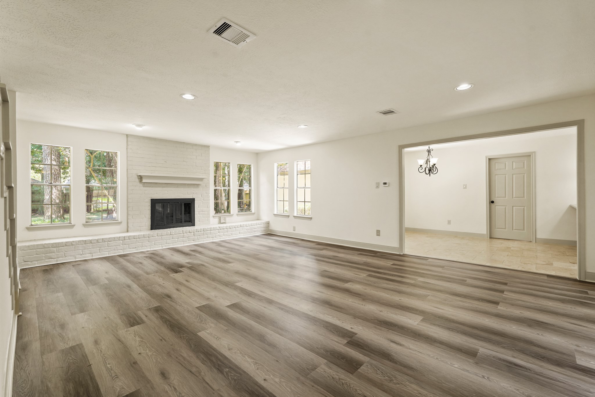 17606 Rustington Drive Spring, TX 77379 - Photo 20 of 44 a view of empty room with wooden floor and fireplace