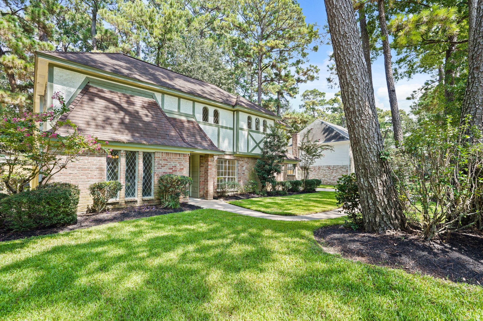 17606 Rustington Drive Spring, TX 77379 - Photo 2 of 44 a view of a house with a yard and sitting area