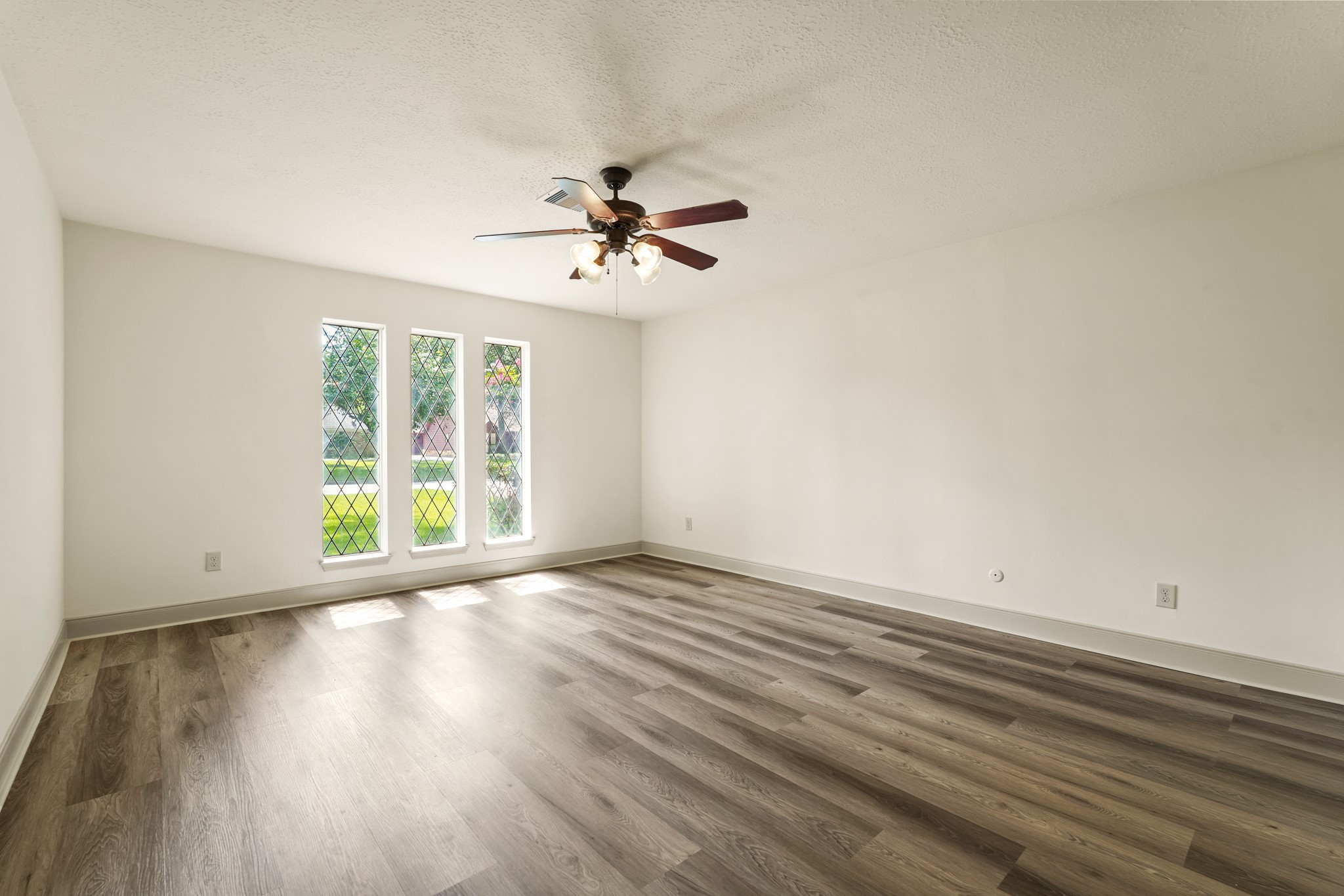 17606 Rustington Drive Spring, TX 77379 - Photo 23 of 44 wooden floor in an empty room with a window