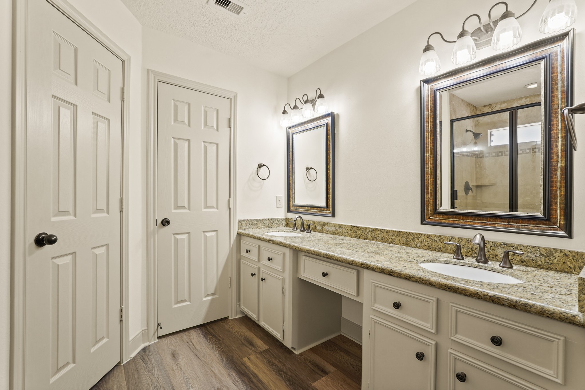 17606 Rustington Drive Spring, TX 77379 - Photo 27 of 44 a bathroom with a granite countertop double vanity sink mirror and