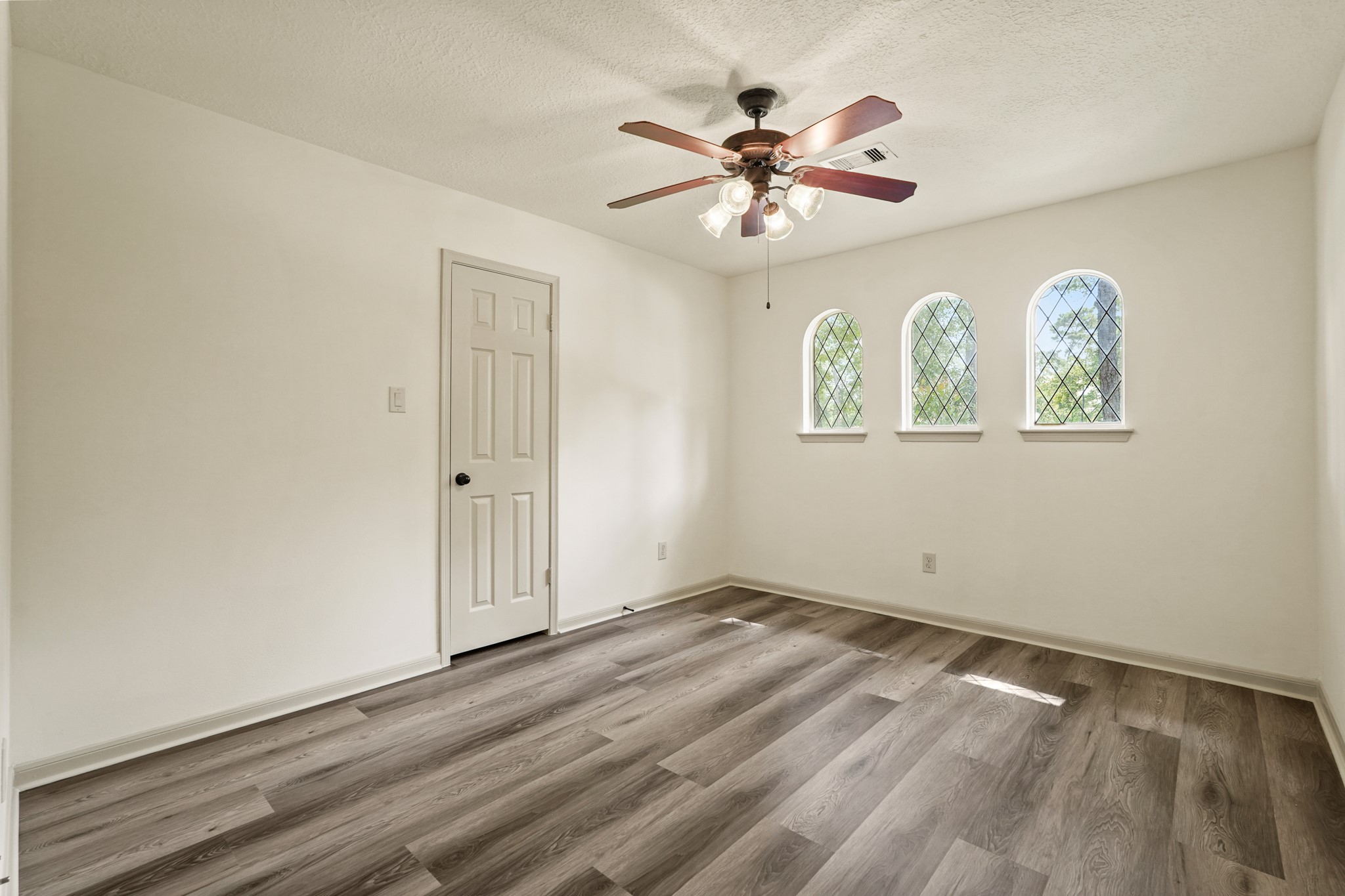 17606 Rustington Drive Spring, TX 77379 - Photo 31 of 44 a view of empty room with wooden floor