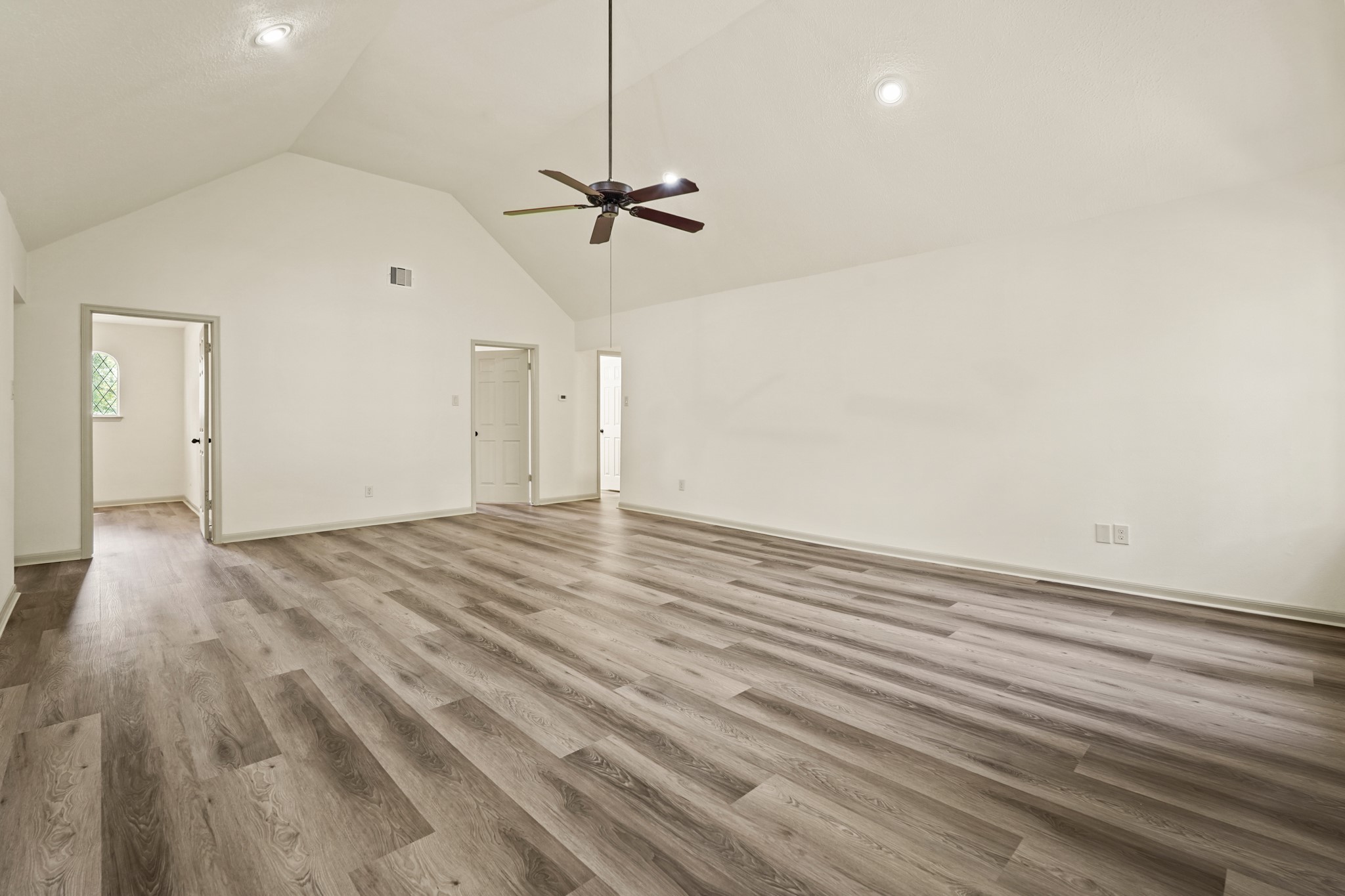 17606 Rustington Drive Spring, TX 77379 - Photo 35 of 44 a view of empty room with wooden floor and ceiling fan