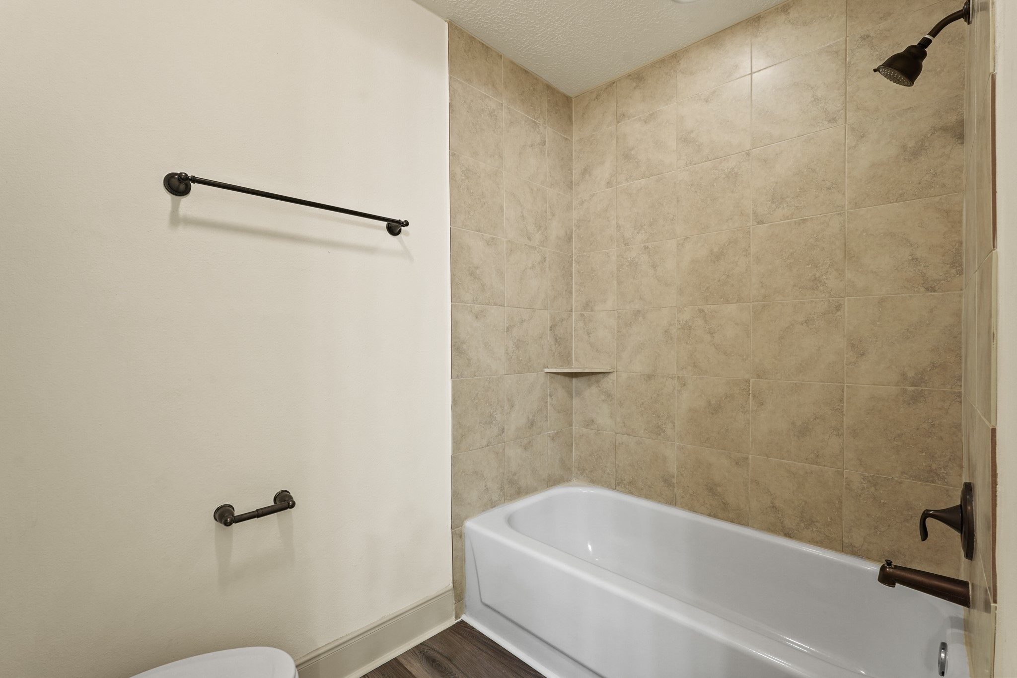 17606 Rustington Drive Spring, TX 77379 - Photo 39 of 44 a bathroom with a bathtub and a toilet