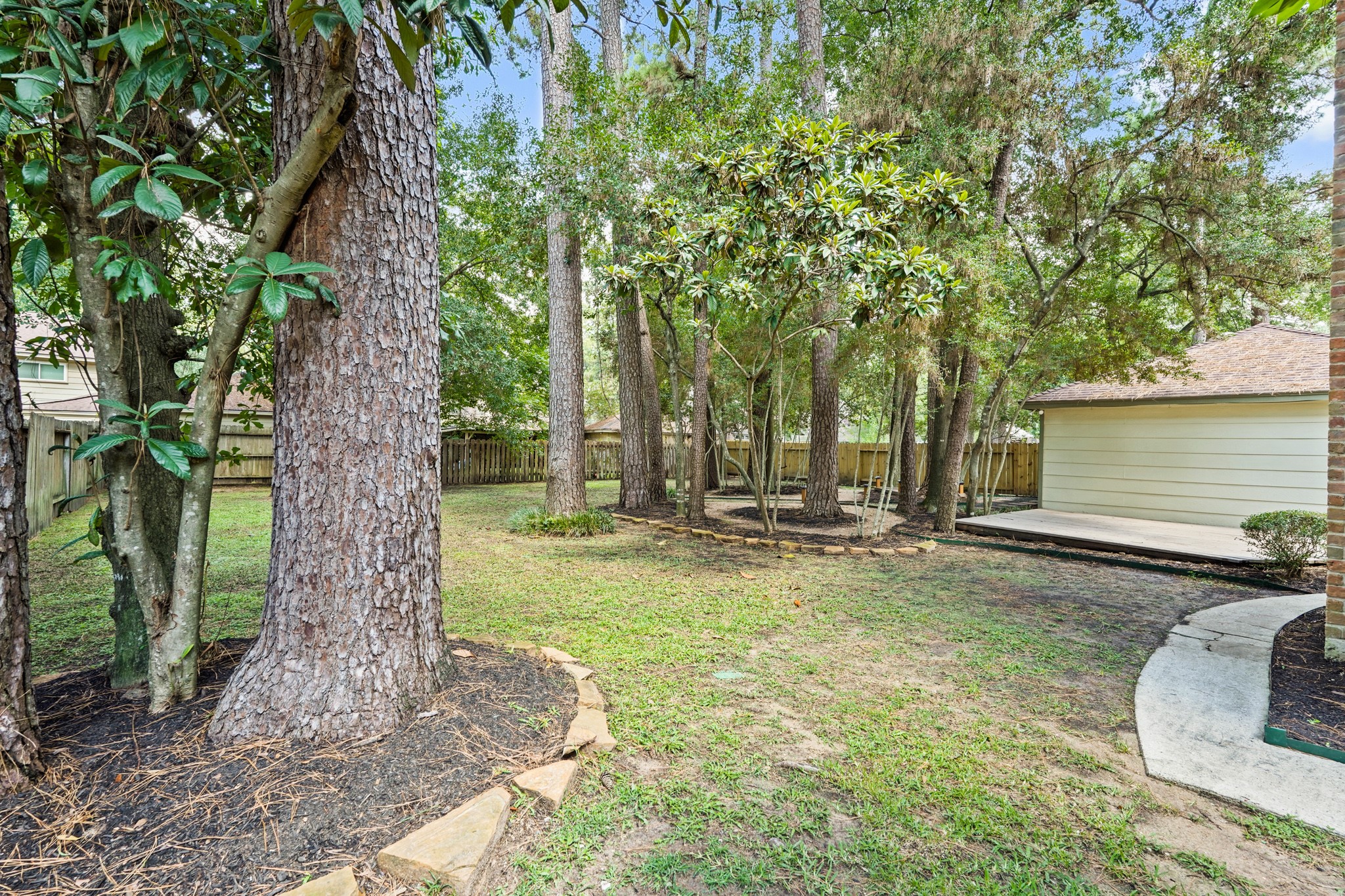17606 Rustington Drive Spring, TX 77379 - Photo 40 of 44 a backyard of a house with table and chairs