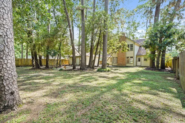 a house that has a tree in front of it