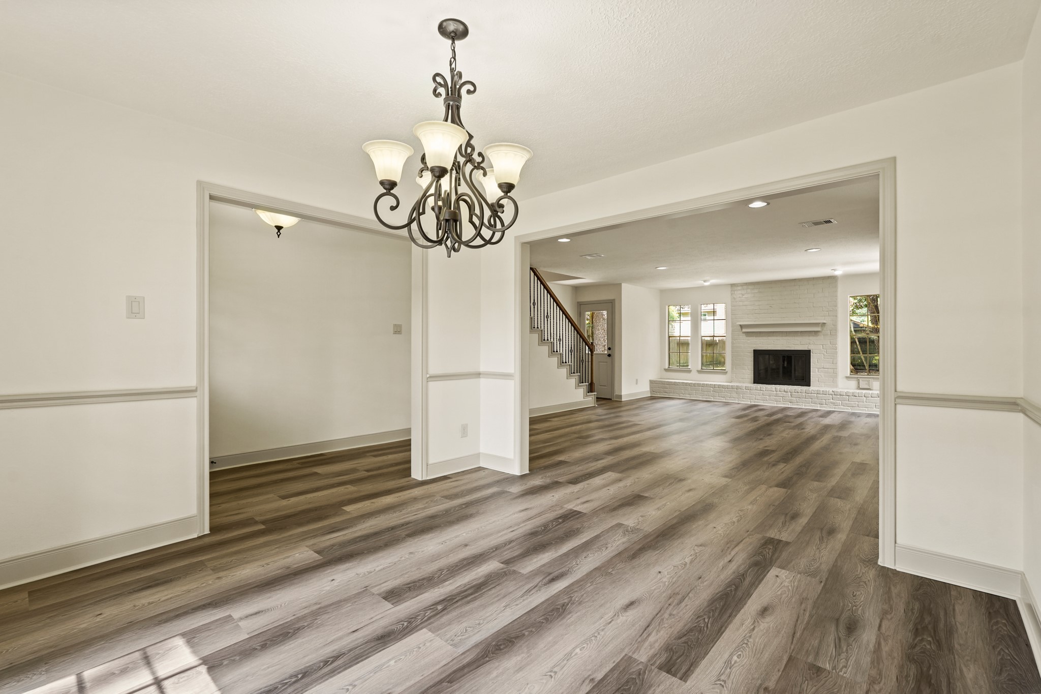 17606 Rustington Drive Spring, TX 77379 - Photo 9 of 44 a view of a livingroom with wooden floor and a ceiling fan