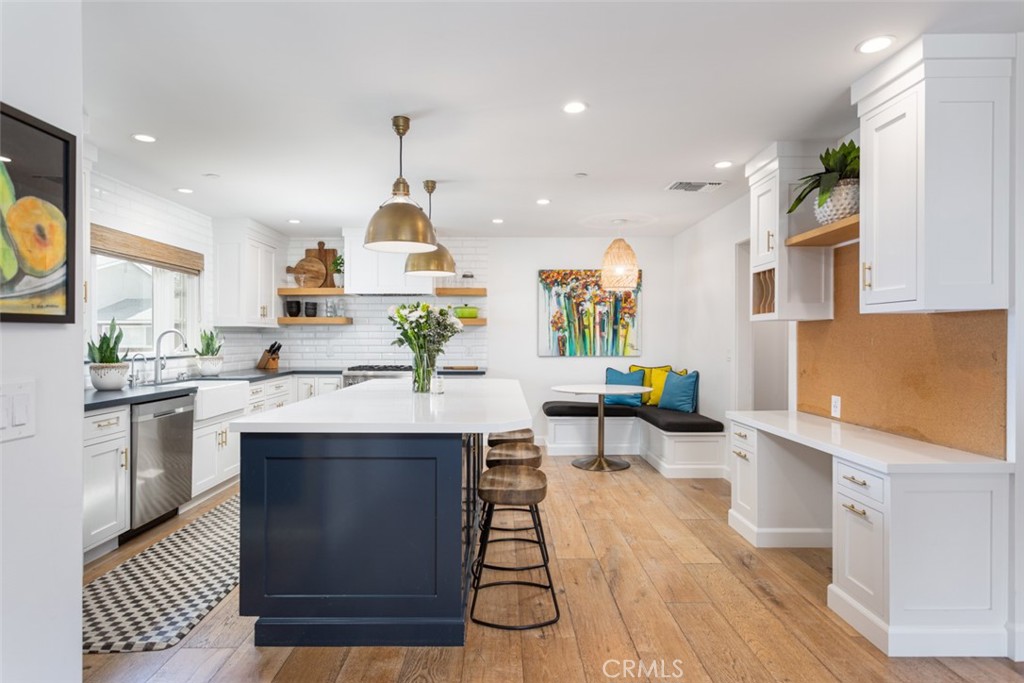 620 Gary Place Newport Beach, CA 92663 - Photo 13 of 36 a kitchen with stainless steel appliances granite countertop a stove a sink dishwasher and a refrigerator with wooden floor