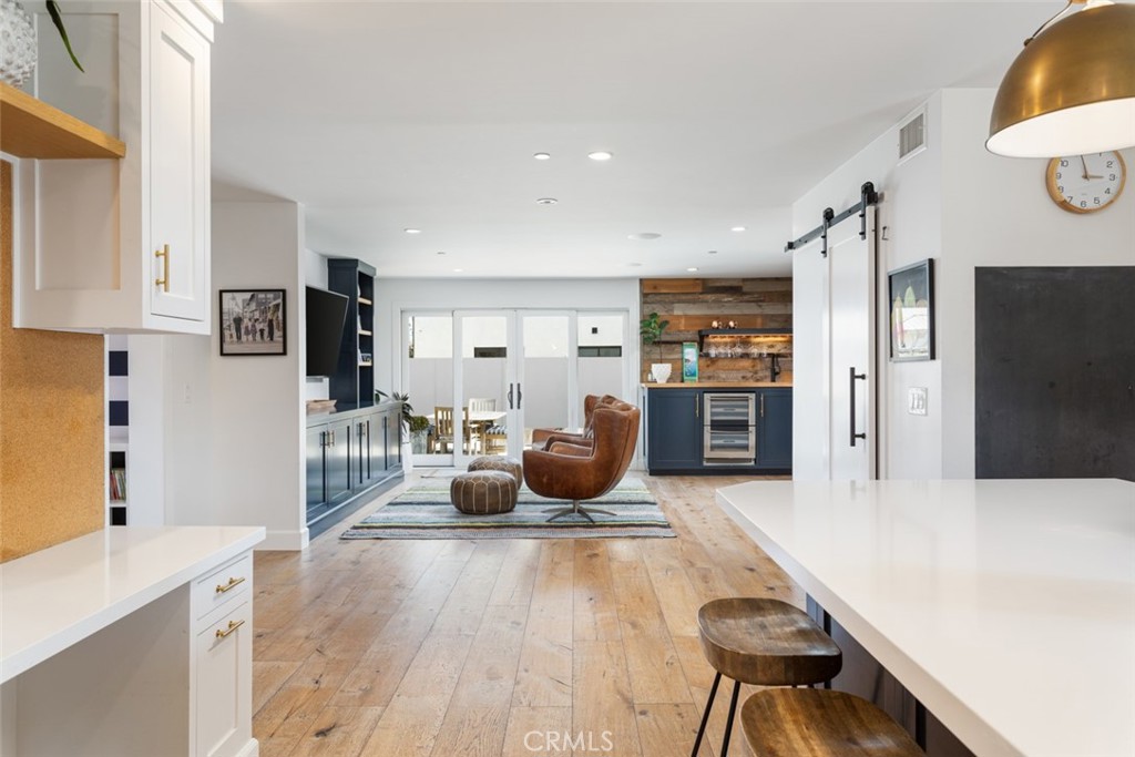 620 Gary Place Newport Beach, CA 92663 - Photo 15 of 36 a living room with stainless steel appliances furniture a refrigerator and a kitchen view