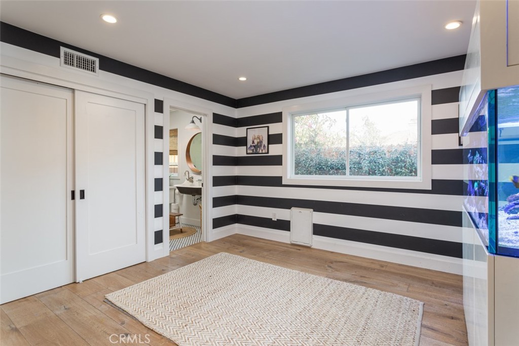 620 Gary Place Newport Beach, CA 92663 - Photo 28 of 36 a view of walk in closet with clothes and shoes