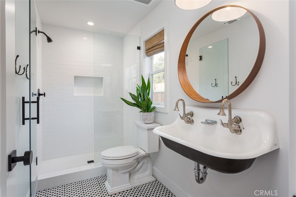 620 Gary Place Newport Beach, CA 92663 - Photo 29 of 36 a bathroom with a sink toilet and a mirror
