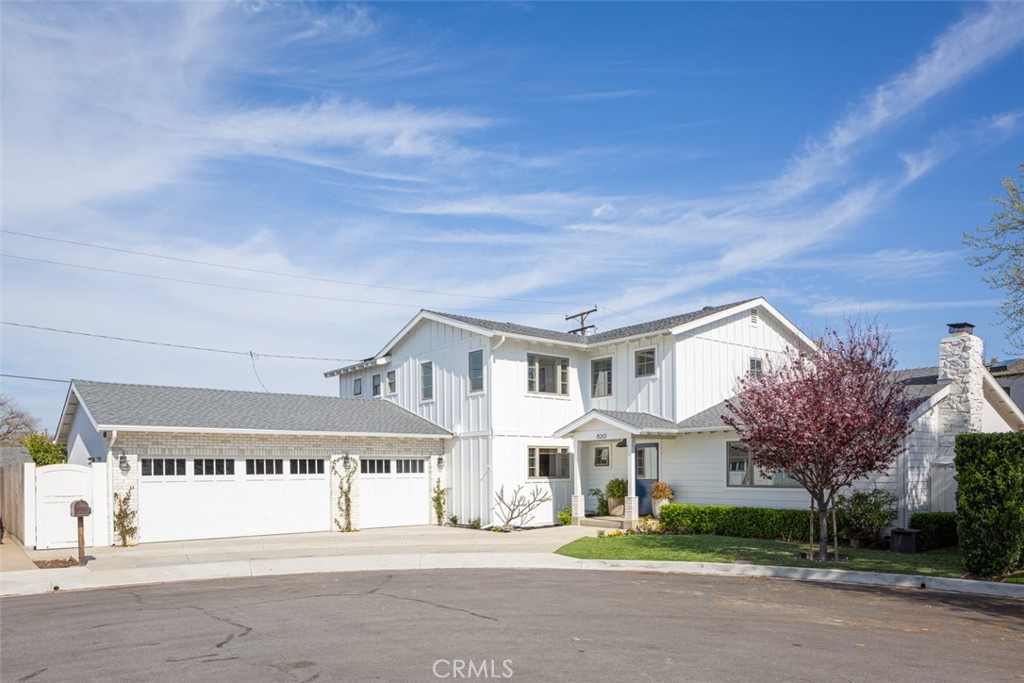 620 Gary Place Newport Beach, CA 92663 - Photo 3 of 36 a front view of residential houses with yard and tree s