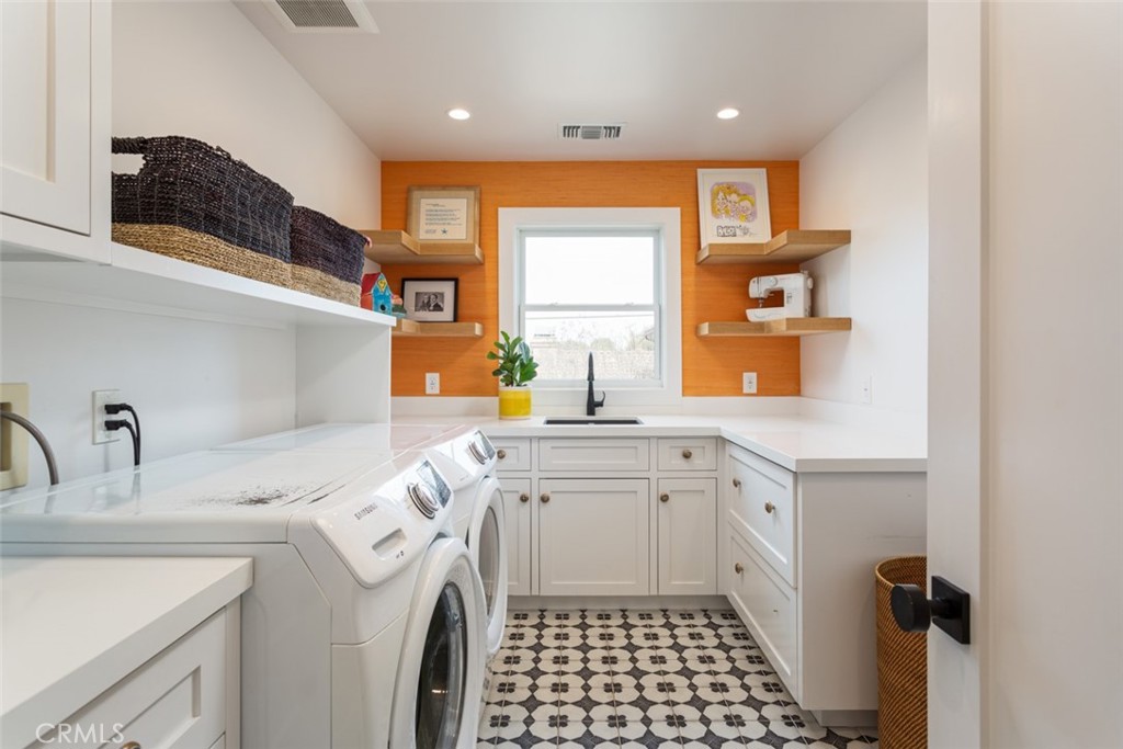 620 Gary Place Newport Beach, CA 92663 - Photo 31 of 36 a kitchen with a sink a stove cabinets and a window
