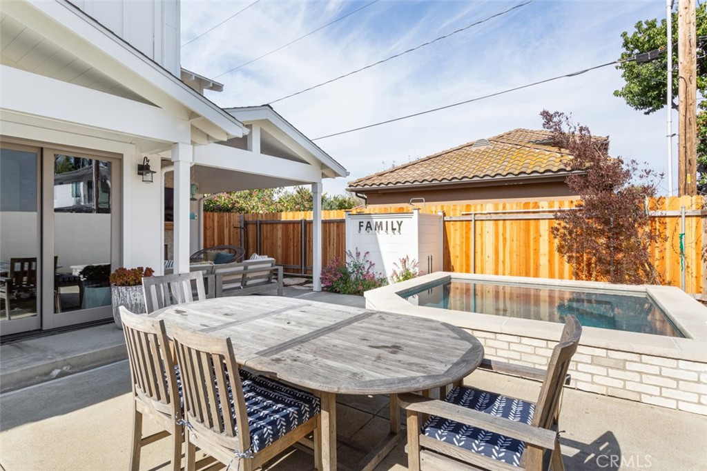 620 Gary Place Newport Beach, CA 92663 - Photo 32 of 36 a view of a patio with table and chairs and potted plants