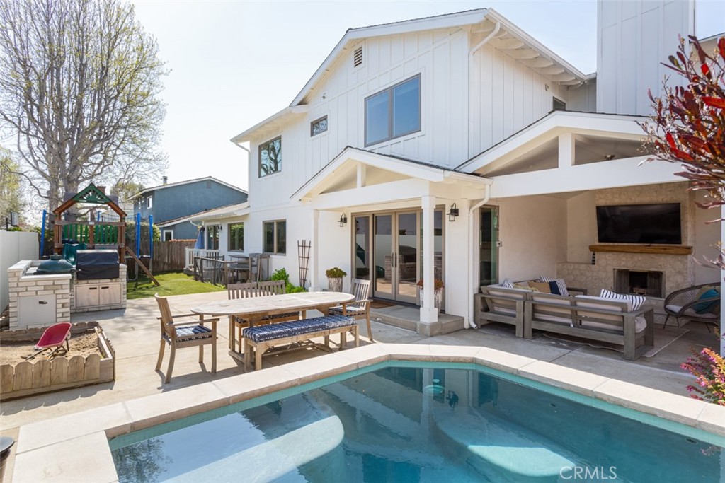 620 Gary Place Newport Beach, CA 92663 - Photo 34 of 36 a view of a white house with swimming pool in front of it
