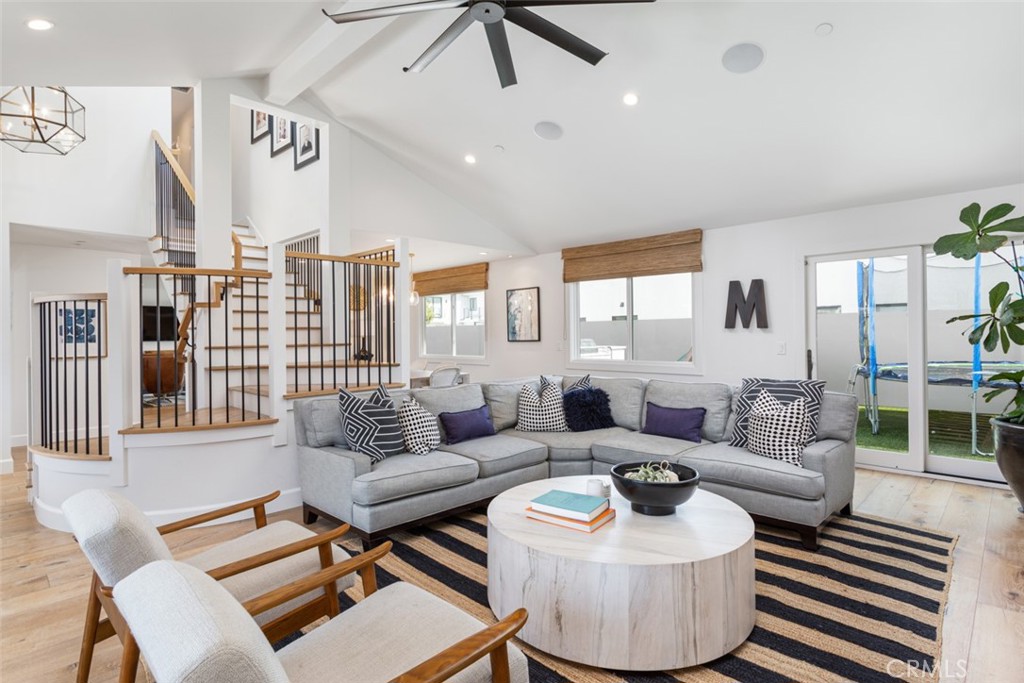 620 Gary Place Newport Beach, CA 92663 - Photo 6 of 36 a living room with furniture and a large window