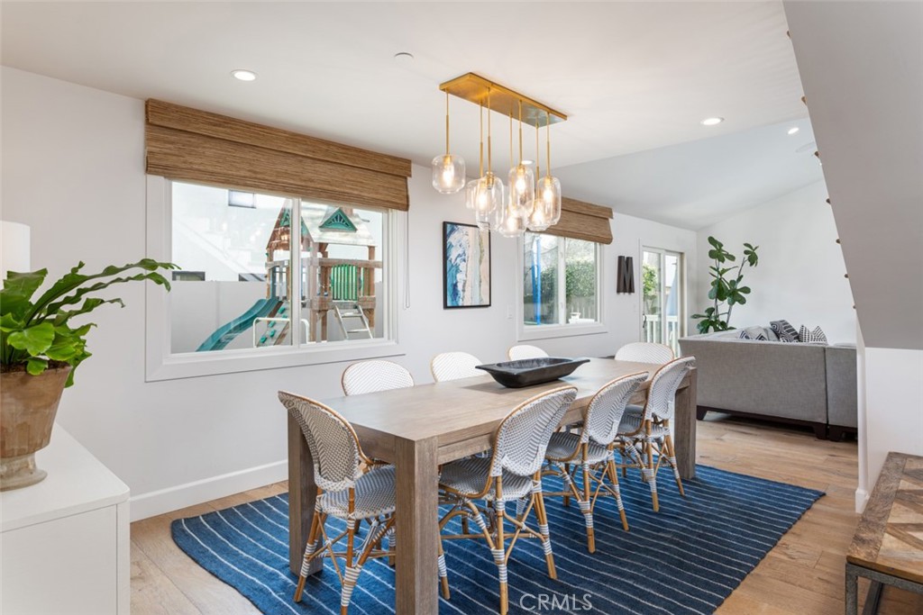 620 Gary Place Newport Beach, CA 92663 - Photo 9 of 36 a view of a dining room with furniture window and wooden floor