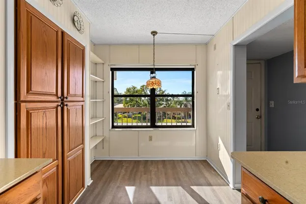 a kitchen with stainless steel appliances granite countertop a sink and a refrigerator