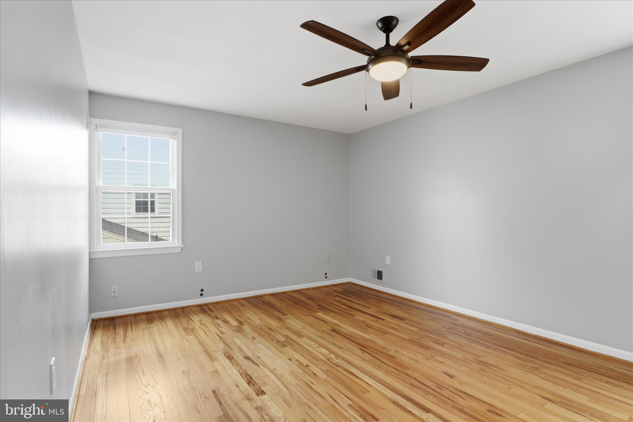 1600 Billman Lane Silver Spring, MD 20902 - Photo 13 of 41 an empty room with a window and a ceiling fan