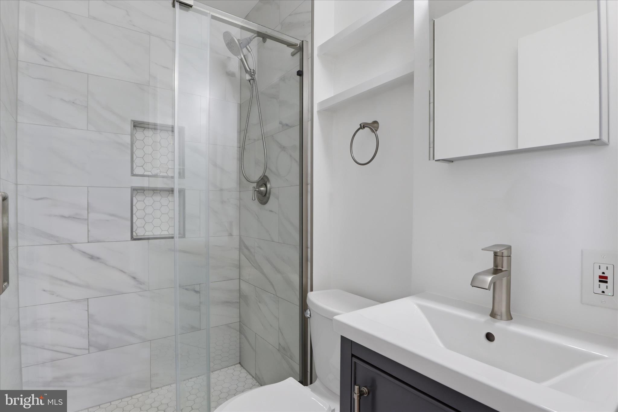 1600 Billman Lane Silver Spring, MD 20902 - Photo 15 of 41 a bathroom with a sink toilet and shower