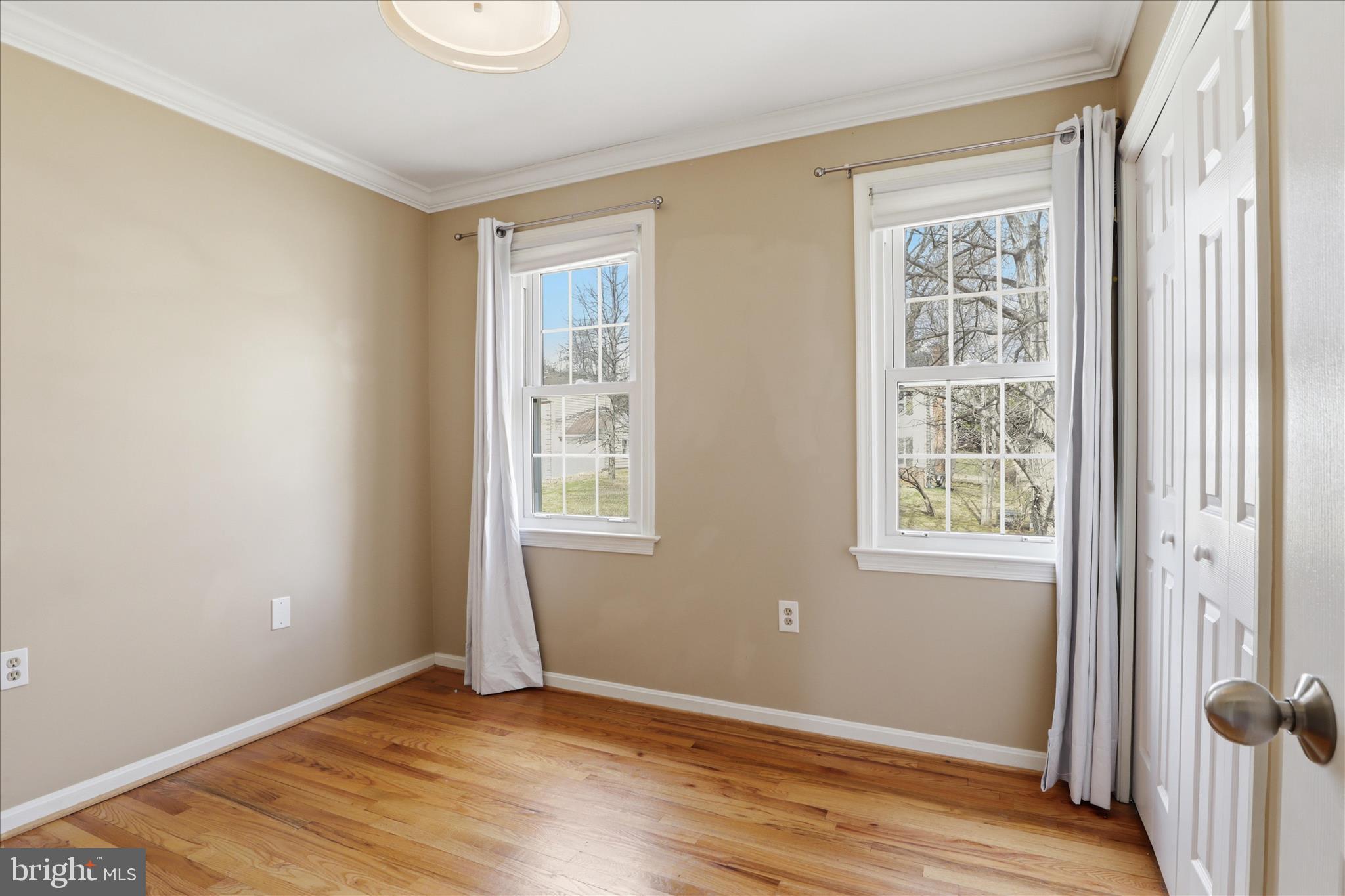 1600 Billman Lane Silver Spring, MD 20902 - Photo 16 of 41 a view of an empty room with wooden floor and a window