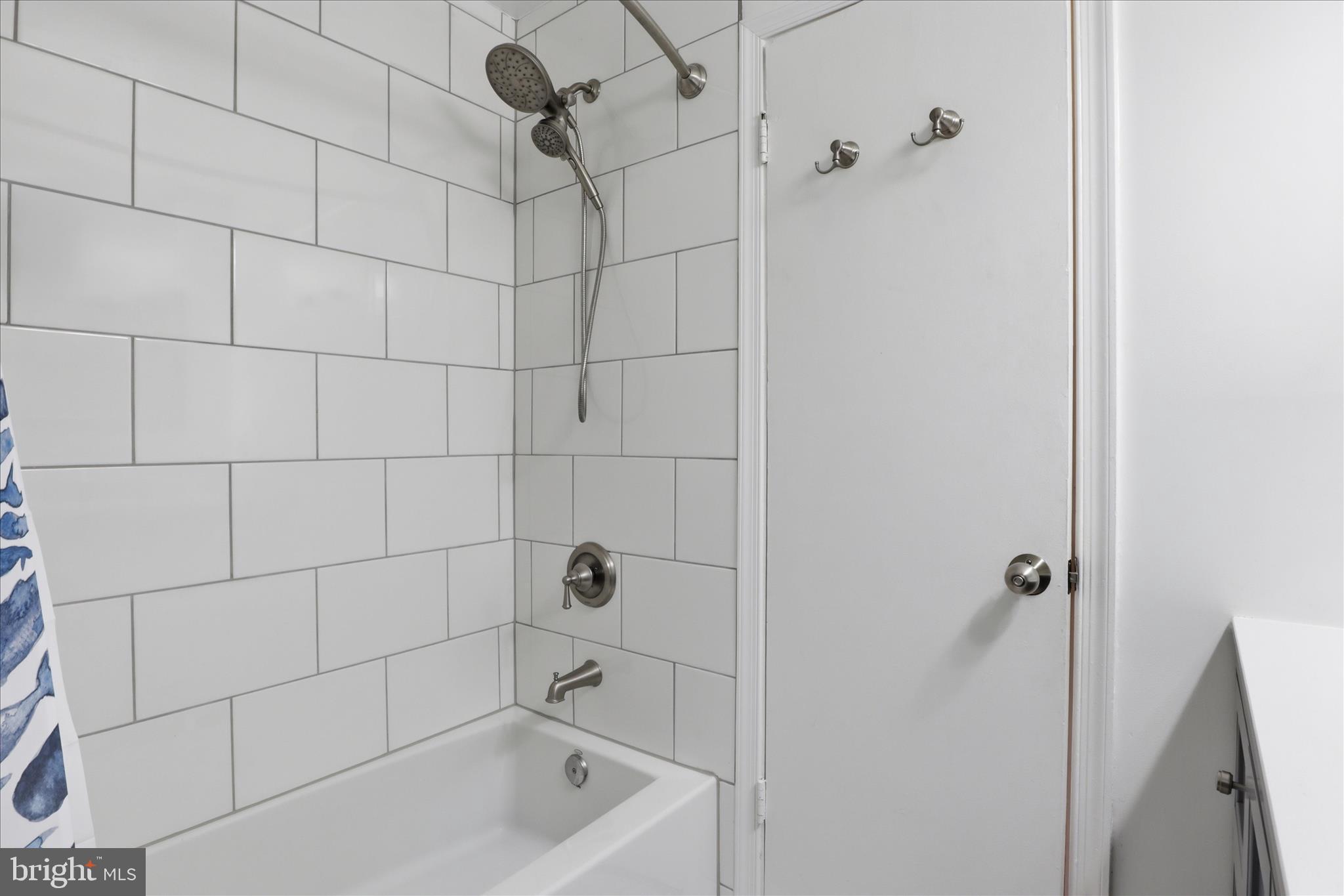 1600 Billman Lane Silver Spring, MD 20902 - Photo 18 of 41 a bathroom with a bathtub and shower