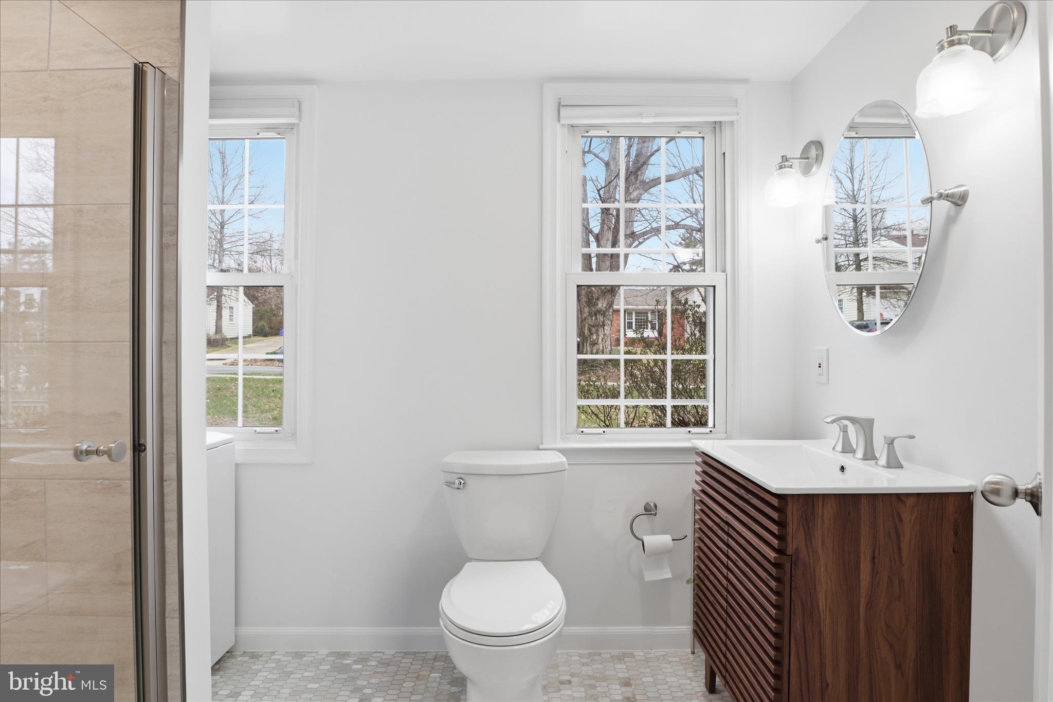 1600 Billman Lane Silver Spring, MD 20902 - Photo 24 of 41 a bathroom with a sink a toilet and shower