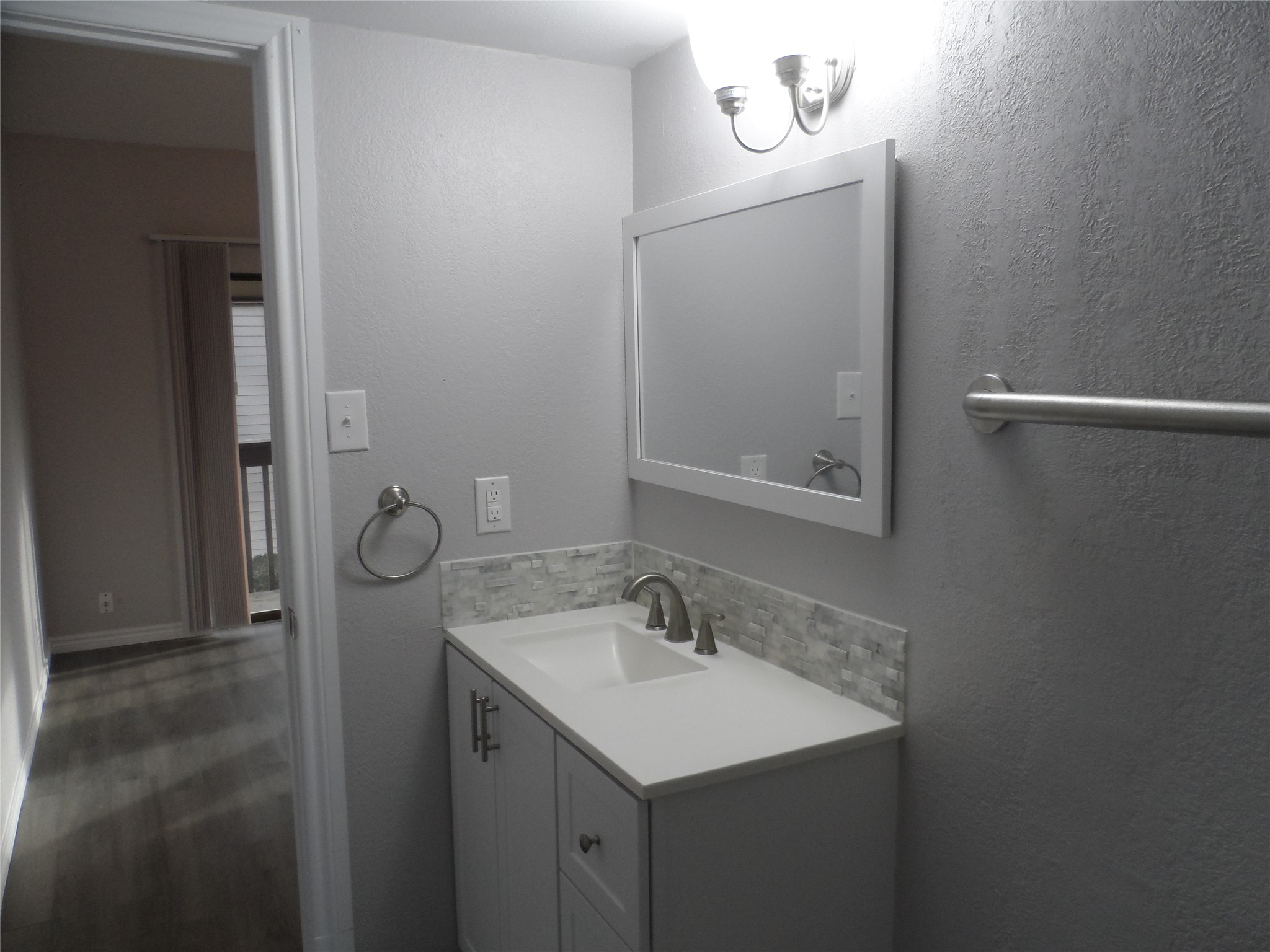12900 Walden Road, Unit 618F Montgomery, TX 77356 - Photo 8 of 19 a bathroom with a sink vanity and mirror