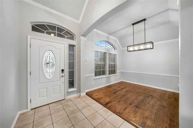 a view of an entryway with wooden floor