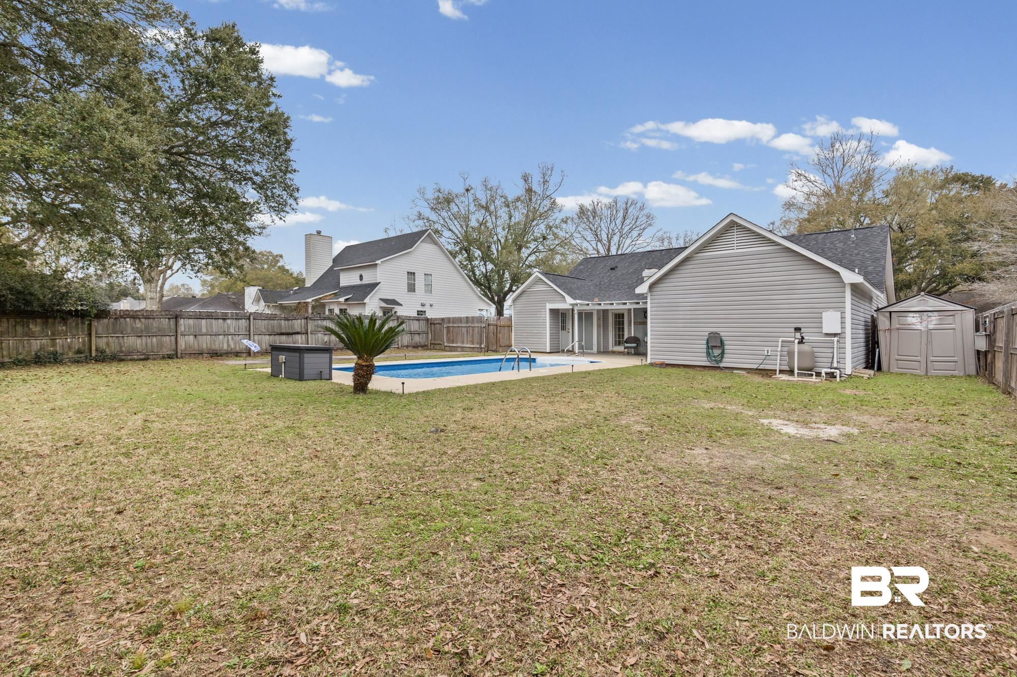 6609 Blakeley Court Mobile, AL 36695 - Photo 25 of 28 Back of house with a shed, a patio area, and a fenced backyard