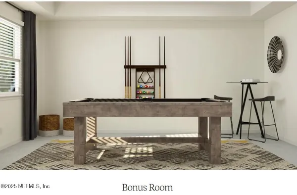 a view of a dining room with furniture and a potted plant