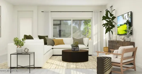 a living room with furniture and a large window with garden view