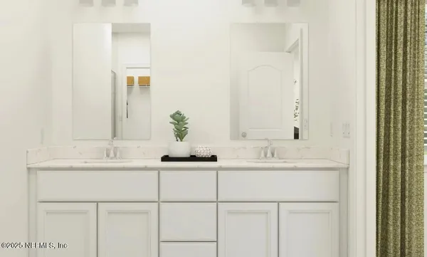 a bed sitting in a bedroom next to a window with a balcony