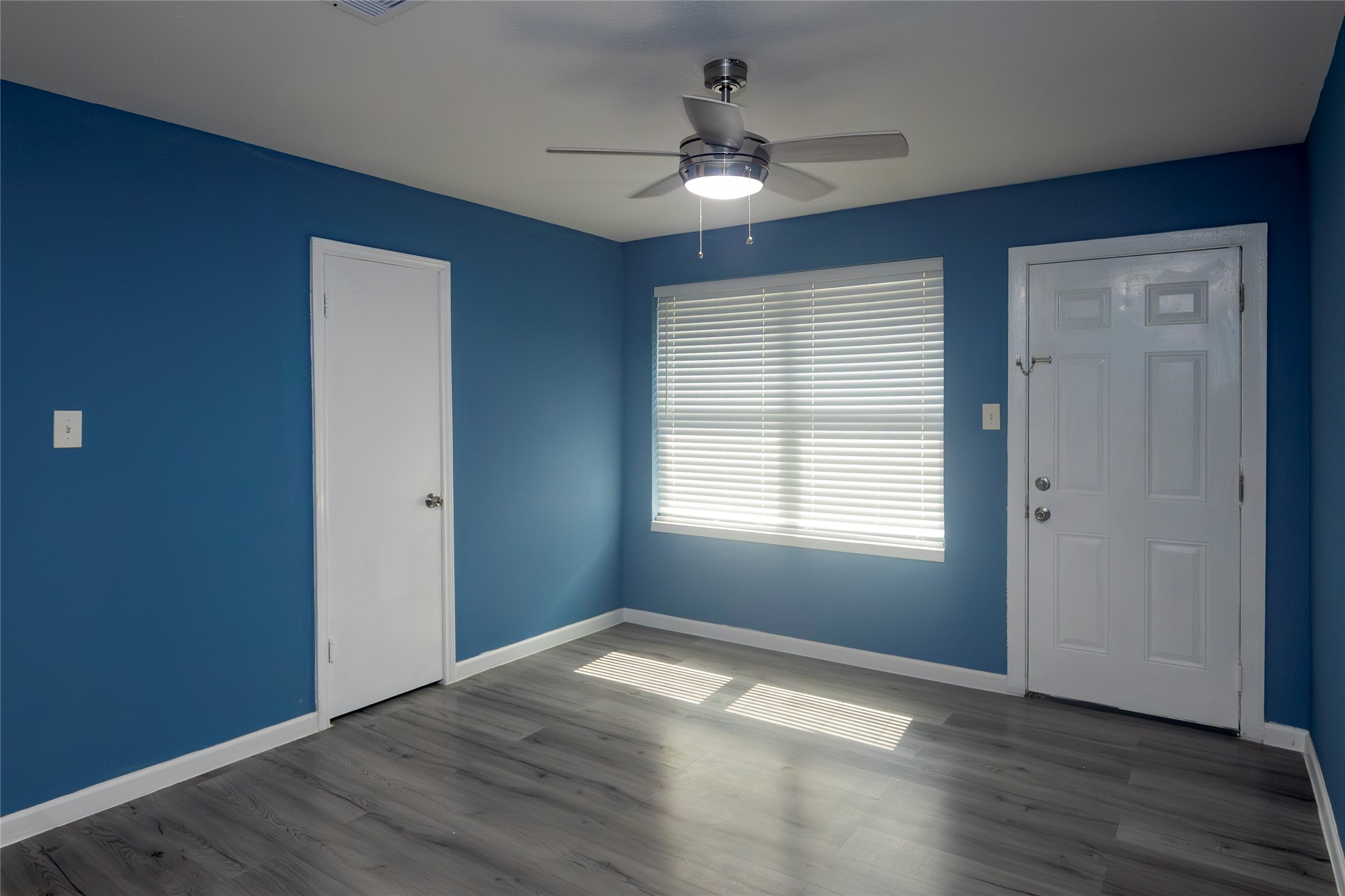 716 Hargest Street, Unit B Prairie View, TX 77445 - Photo 7 of 11 a view of empty room with wooden floor and fan