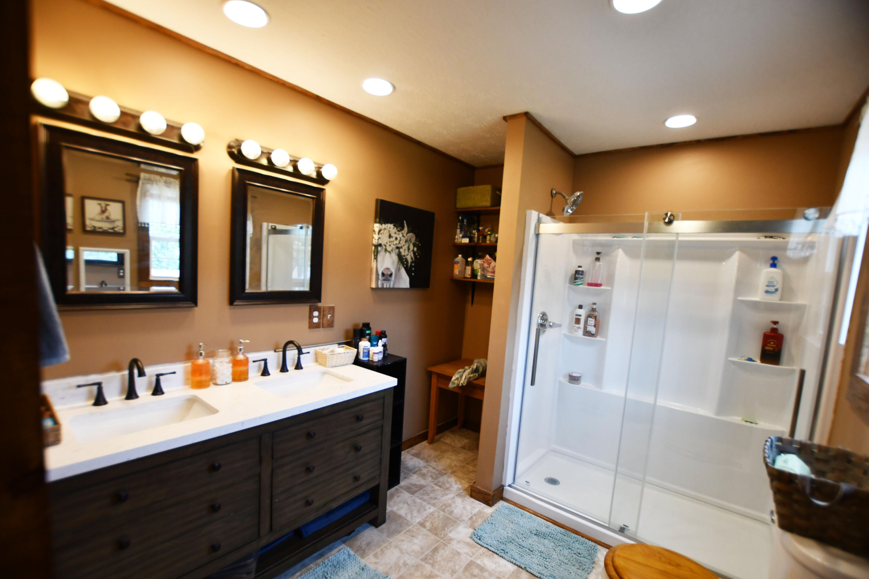 1410 Winston Road Irvine, KY 40336 - Photo 22 of 43 A true owner's suite bathroom! This oversized owner's bathroom offers a double vanity, abundant storage, and a large walk-in shower!