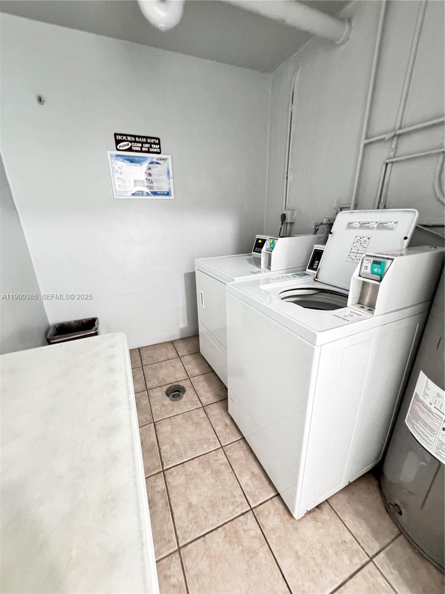 9441 Evergreen Place, Unit 206 Davie, FL 33324 - Photo 9 of 11 a utility room with dryer and washer